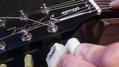 How to Replace Electric Guitar Strings: A Symphony of Chaos and Order