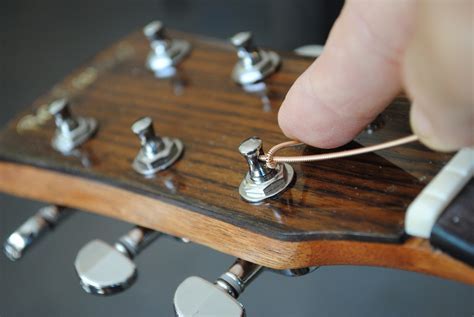 How to Tie Guitar Strings Electric: A Symphony of Strings and Circuits